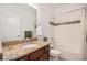 Cozy bathroom featuring warm colors and a shower and bathtub combination at 11791 Barrentine Loop, Parker, CO 80138