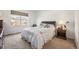 Bright bedroom with a large window and comfortable furnishings at 11791 Barrentine Loop, Parker, CO 80138