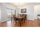 Dining room featuring sliding glass doors, hardwood floors, and contemporary lighting at 11791 Barrentine Loop, Parker, CO 80138