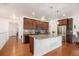 Modern kitchen with stainless steel appliances, granite countertops, and a large island at 11791 Barrentine Loop, Parker, CO 80138