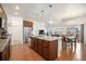 Spacious kitchen featuring an island, stainless steel appliances, and an open layout to the living room and dining area at 11791 Barrentine Loop, Parker, CO 80138