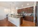 Updated kitchen featuring granite countertops, stainless appliances, and elegant pendant lighting at 11791 Barrentine Loop, Parker, CO 80138