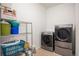 Practical laundry room with modern washer and dryer at 11791 Barrentine Loop, Parker, CO 80138