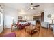 Open floor plan living room featuring hardwood floors, and view of dining area and kitchen at 11791 Barrentine Loop, Parker, CO 80138