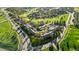 Aerial view of townhomes surrounded by mature landscaping and green spaces at 6519 Pinewood Dr, Parker, CO 80134