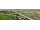 Expansive aerial view showcasing a golf course and neighborhood at 6519 Pinewood Dr, Parker, CO 80134