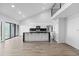 A modern kitchen features a kitchen island, stainless appliances, and an adjacent dining area at 6519 Pinewood Dr, Parker, CO 80134