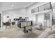 Open-concept living space with a modern kitchen, dining area, and comfortable seating at 6519 Pinewood Dr, Parker, CO 80134