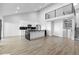 Open living room featuring a staircase, kitchen with marble countertops, and a loft view at 6519 Pinewood Dr, Parker, CO 80134