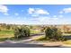 Charming street view of a home showcasing lush trees and landscaping at 6519 Pinewood Dr, Parker, CO 80134