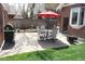 Private backyard featuring a patio set, grill, and space for outdoor entertainment at 832 S Gilpin St, Denver, CO 80209