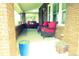 Inviting covered front porch with comfortable seating and brick pillars at 832 S Gilpin St, Denver, CO 80209