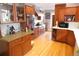 Spacious kitchen featuring wood cabinets, granite countertops, hardwood floors, and stainless steel appliances at 832 S Gilpin St, Denver, CO 80209