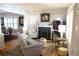 Elegant living room with fireplace, neutral tones, and ample natural light at 832 S Gilpin St, Denver, CO 80209
