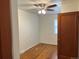 Bright bedroom with hardwood floors, a ceiling fan, and large windows for natural light at 5899 Vance St, Arvada, CO 80003