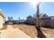 Backyard with gravel, a small concrete slab, and cars parked out front at 119 Yakima St, Lochbuie, CO 80603