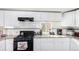 Close up of the Kitchen showing gas range, stainless steel appliances, granite countertops and white subway tile backsplash at 119 Yakima St, Lochbuie, CO 80603