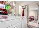 A laundry room features a washer, dryer, and extra storage shelving at 119 Yakima St, Lochbuie, CO 80603