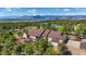 Stunning aerial view of home with mountain views, mature trees, and a large deck at 17575 Minglewood Trl, Monument, CO 80132