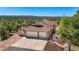 Aerial view of the home, three-car garage, and well-maintained grounds at 17575 Minglewood Trl, Monument, CO 80132