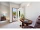 Bright bedroom leading to a large back deck with seating and wooded views at 17575 Minglewood Trl, Monument, CO 80132