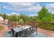 Outdoor deck featuring wood furniture and a beautiful tree view at 17575 Minglewood Trl, Monument, CO 80132