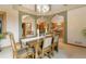 Cozy dining area with arched entrances and views into the kitchen at 17575 Minglewood Trl, Monument, CO 80132