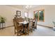 Traditional dining room with wood furniture and a picturesque view from the window at 17575 Minglewood Trl, Monument, CO 80132