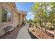 Exterior of home with bench, walkway, and terraced landscaping at 17575 Minglewood Trl, Monument, CO 80132