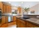 Spacious kitchen featuring wood cabinets and countertops, stainless steel appliances, and a window with a view at 17575 Minglewood Trl, Monument, CO 80132