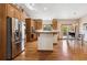 Spacious kitchen featuring wooden cabinetry, stainless steel appliances and hardwood floors at 17575 Minglewood Trl, Monument, CO 80132