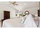 Comfortable main bedroom featuring a large bed, vaulted ceiling and scenic views at 17575 Minglewood Trl, Monument, CO 80132