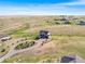 Aerial view of a home with a circular driveway and lush landscaping at 3654 Paintbrush Ln, Parker, CO 80138