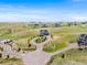 Aerial view showcasing a home with a circular driveway and beautiful landscaping at 3654 Paintbrush Ln, Parker, CO 80138