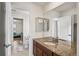 Bathroom featuring large mirror, a granite vanity and tile floors at 3654 Paintbrush Ln, Parker, CO 80138