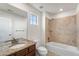 Bathroom showcasing single vanity and shower-tub combo with tiled surround at 3654 Paintbrush Ln, Parker, CO 80138