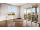 Bedroom featuring a large window and sliding glass doors to an outdoor balcony at 3654 Paintbrush Ln, Parker, CO 80138