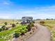 Exterior view of a two-story home with manicured landscaping and an inviting driveway at 3654 Paintbrush Ln, Parker, CO 80138