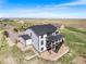 Two-story home has a covered deck, set amidst a sprawling landscape on a clear, sunny day at 3654 Paintbrush Ln, Parker, CO 80138