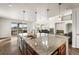 Gourmet kitchen featuring a granite island, stainless steel appliances, and open floor plan at 3654 Paintbrush Ln, Parker, CO 80138