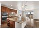 Spacious kitchen with a granite island, stainless appliances, and sliding doors to the outdoor area at 3654 Paintbrush Ln, Parker, CO 80138