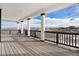 Covered porch featuring white columns and black railings with amazing views at 3654 Paintbrush Ln, Parker, CO 80138
