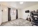 This bedroom has carpeted floors, natural light and a TV at 4912 Altura St, Denver, CO 80239