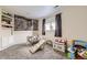 This bright playroom offers carpeted floors, a window, and lots of open space at 4912 Altura St, Denver, CO 80239