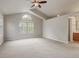 Large main bedroom with ensuite bath featuring vaulted ceilings and neutral carpeting at 6735 W 97Th Cir, Westminster, CO 80021