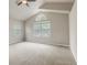 Spacious bedroom with vaulted ceiling, large windows, and neutral carpet flooring at 6735 W 97Th Cir, Westminster, CO 80021
