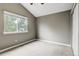 Neutral bedroom offers a large window allowing natural light and soft carpeting at 6735 W 97Th Cir, Westminster, CO 80021