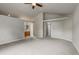 Large main bedroom with ensuite bathroom, ceiling fan and neutral carpeting at 6735 W 97Th Cir, Westminster, CO 80021
