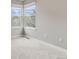 Cozy bedroom featuring plush carpets, large windows, and a neutral color scheme at 6735 W 97Th Cir, Westminster, CO 80021