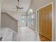 Bright and inviting entryway with vaulted ceilings, large windows, and modern ceiling fan at 6735 W 97Th Cir, Westminster, CO 80021